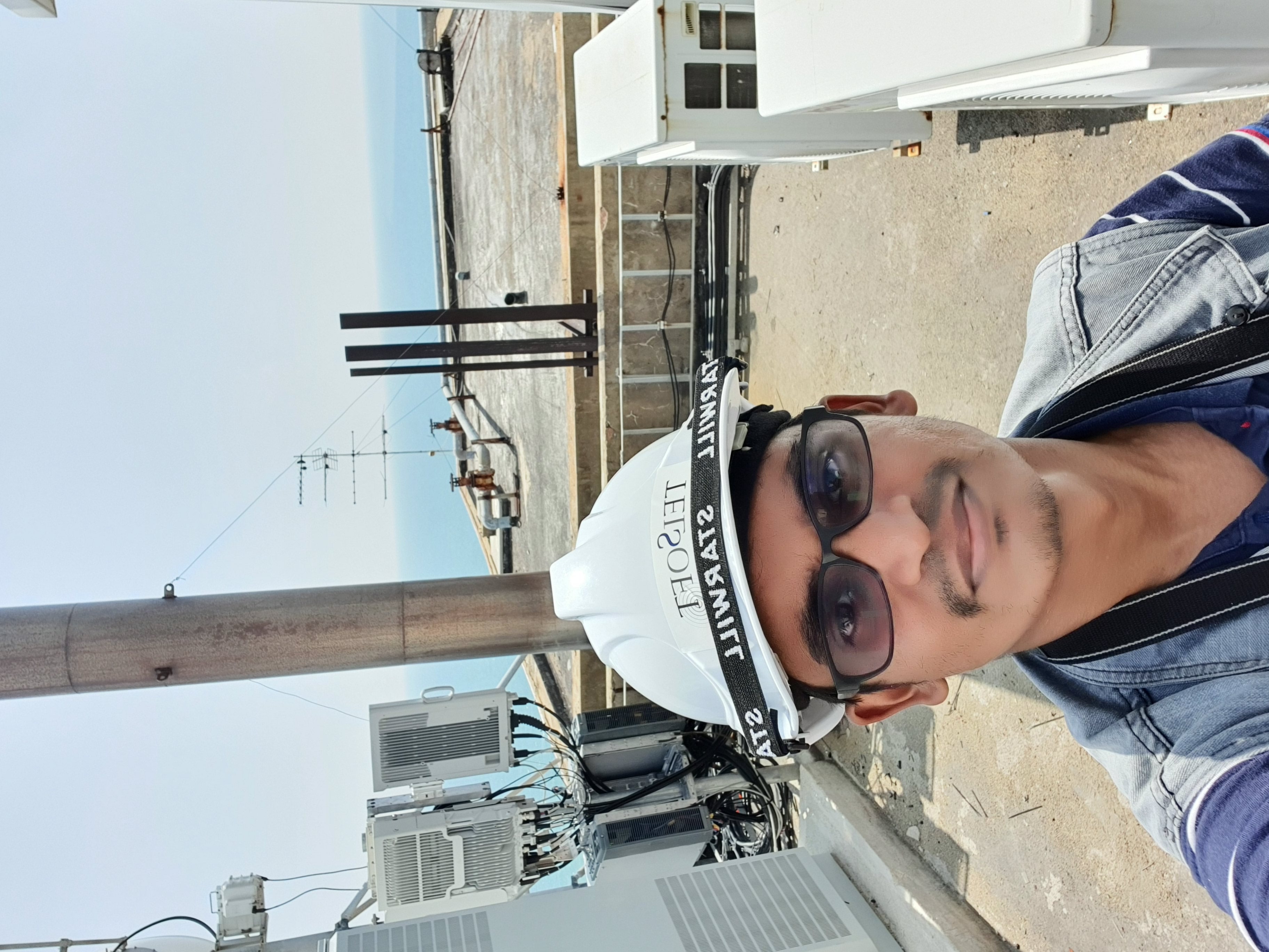 Telecommunications field engineer at a rooftop site