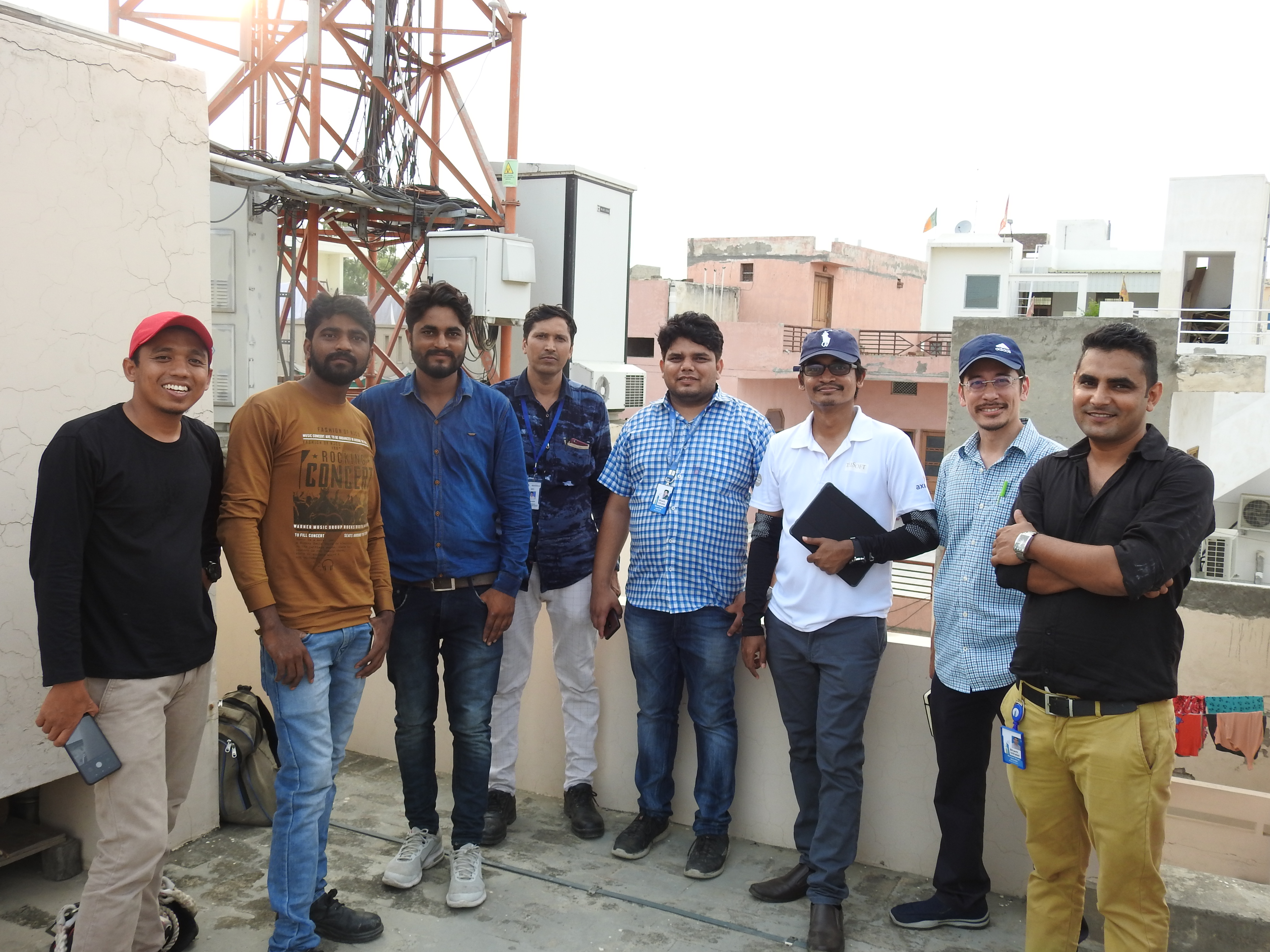 Telecommunications engineering team on a rooftop site